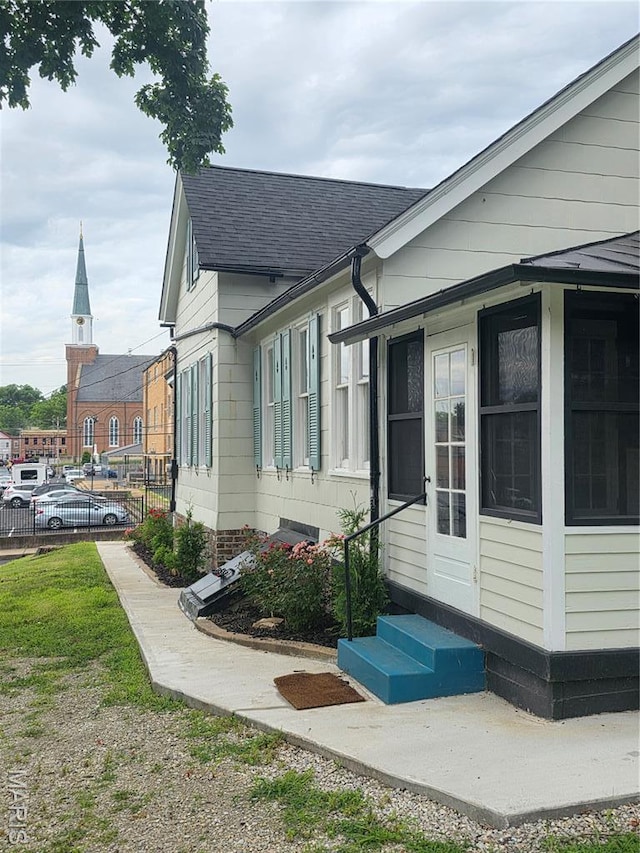 371 Jefferson St, Saint Genevieve, MO 63670 - view of property exterior featuring entry steps and roof with shingles