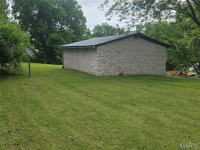 371 Jefferson St, Saint Genevieve, MO 63670 - view of home's exterior with a lawn and stone siding