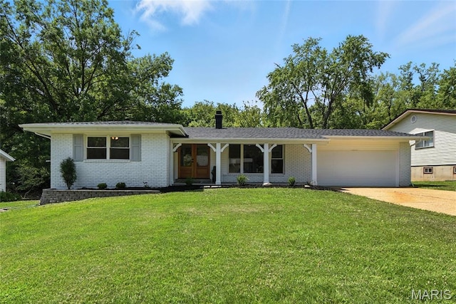 15282 Springrun Dr, Chesterfield, MO 63017 - tri-level home with brick siding, an attached garage, driveway, and a front lawn