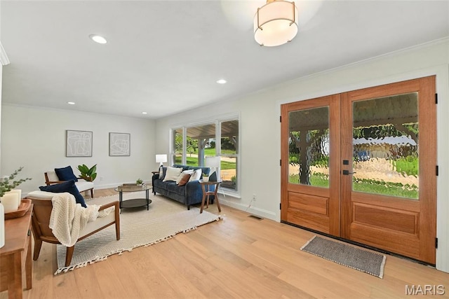 15282 Springrun Dr, Chesterfield, MO 63017 - entryway with light wood-type flooring, ornamental molding, recessed lighting, and french doors