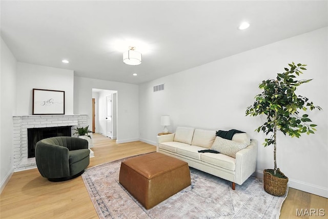 15282 Springrun Dr, Chesterfield, MO 63017 - living area featuring light wood-style floors, recessed lighting, and a fireplace