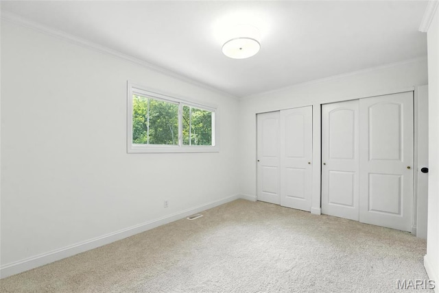 15282 Springrun Dr, Chesterfield, MO 63017 - unfurnished bedroom featuring multiple closets, crown molding, and carpet