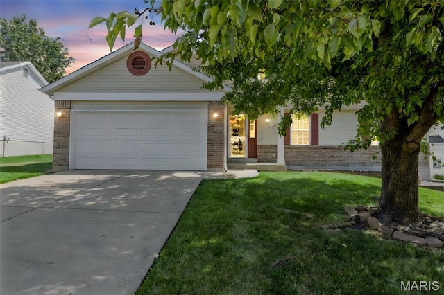 182 Cherrywood Parc Dr, Ofallon, MO 63368 - view of front of home with brick siding, driveway, an attached garage, and a front yard