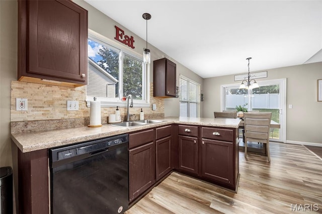 182 Cherrywood Parc Dr, Ofallon, MO 63368 - kitchen with dishwasher, light wood finished floors, plenty of natural light, and light countertops