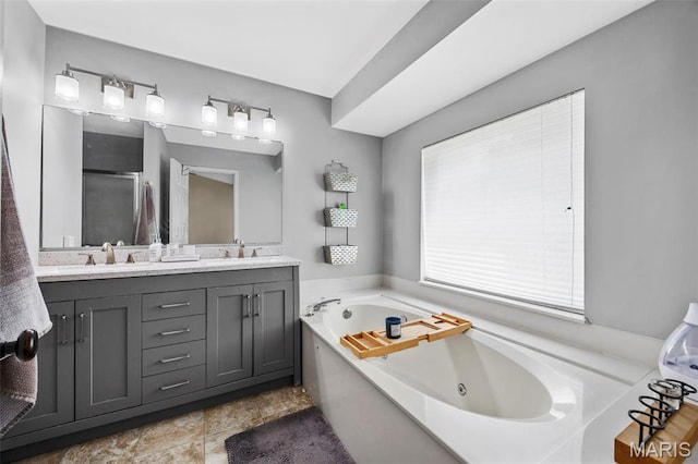 182 Cherrywood Parc Dr, Ofallon, MO 63368 - full bathroom with a jetted tub, double vanity, and a stall shower