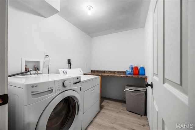 182 Cherrywood Parc Dr, Ofallon, MO 63368 - washroom with washer and dryer and light wood-style flooring