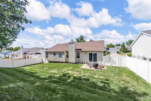 182 Cherrywood Parc Dr, Ofallon, MO 63368 - back of house with a fenced backyard, a gate, a chimney, a patio, and a residential view