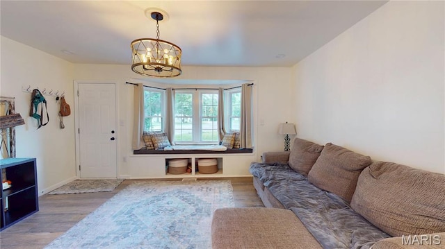 224 Lucinda Dr, Fairview Heights, IL 62208 - living room with wood finished floors and a chandelier