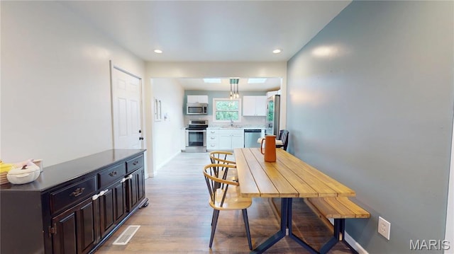224 Lucinda Dr, Fairview Heights, IL 62208 - dining area featuring light wood-type flooring and recessed lighting