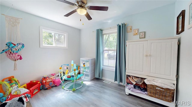 224 Lucinda Dr, Fairview Heights, IL 62208 - recreation room featuring healthy amount of natural light, wood finished floors, and ceiling fan