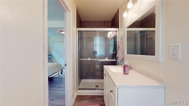 224 Lucinda Dr, Fairview Heights, IL 62208 - ensuite bathroom with vanity, a shower stall, and wood finished floors