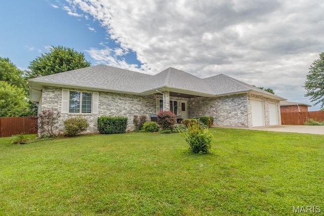 1124 Carpentry Cir, Lebanon, MO 65536 - view of front of home featuring an attached garage, driveway, and a shingled roof