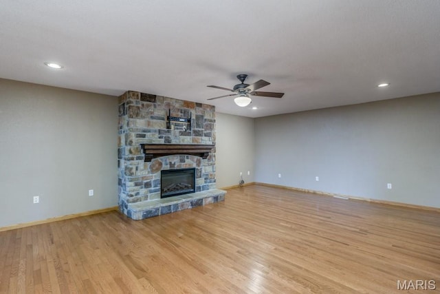 1124 Carpentry Cir, Lebanon, MO 65536 - unfurnished living room featuring ceiling fan, wood finished floors, a fireplace, and recessed lighting
