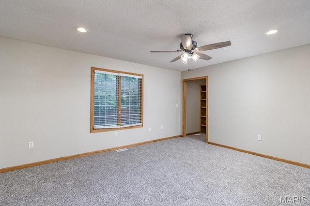 1124 Carpentry Cir, Lebanon, MO 65536 - carpeted spare room with a ceiling fan, recessed lighting, and a textured ceiling