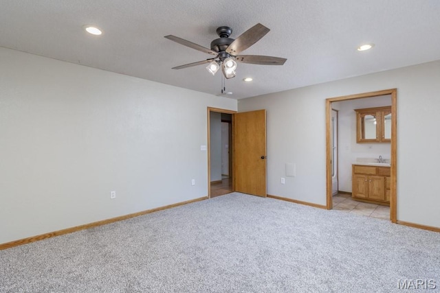 1124 Carpentry Cir, Lebanon, MO 65536 - unfurnished bedroom featuring light colored carpet, recessed lighting, ensuite bathroom, and a ceiling fan