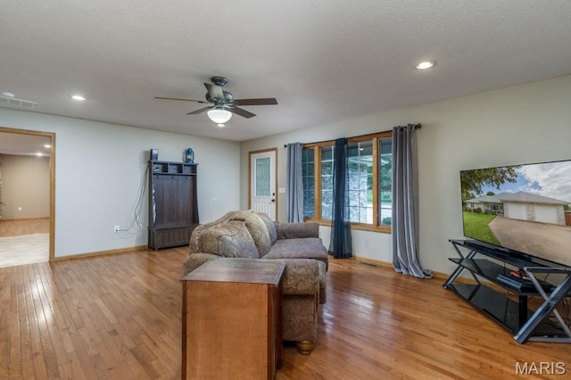 1124 Carpentry Cir, Lebanon, MO 65536 - living room with light wood-type flooring, ceiling fan, and recessed lighting