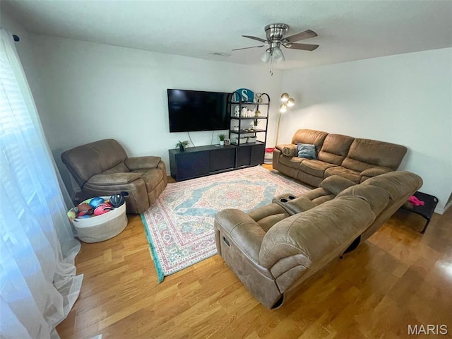 712 W Oak St, Dexter, MO 63841 - living room featuring light wood-style flooring and ceiling fan