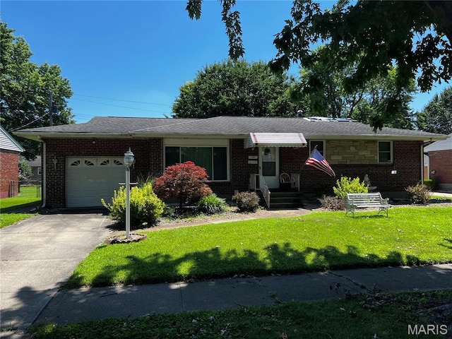 3148 Davis Ave, Granite City, IL 62040 - ranch-style home with a garage, brick siding, a front lawn, and concrete driveway