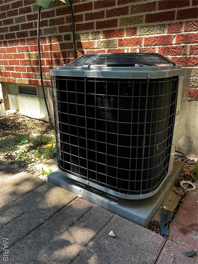 3148 Davis Ave, Granite City, IL 62040 - exterior view of a central air condition unit and brick siding
