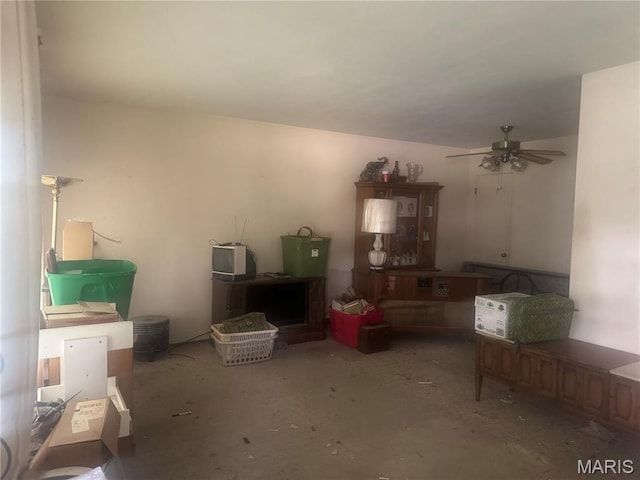 3148 Davis Ave, Granite City, IL 62040 - living room featuring a ceiling fan and concrete floors