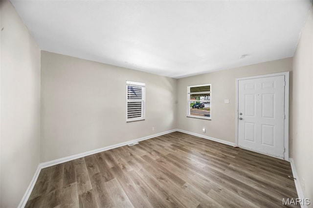 1237 Fairview Ave, University City, MO 63130 - empty room with wood finished floors and baseboards