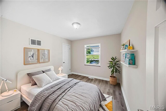 1237 Fairview Ave, University City, MO 63130 - bedroom with baseboards and wood finished floors
