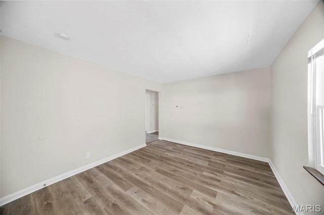 1237 Fairview Ave, University City, MO 63130 - empty room featuring wood finished floors and baseboards