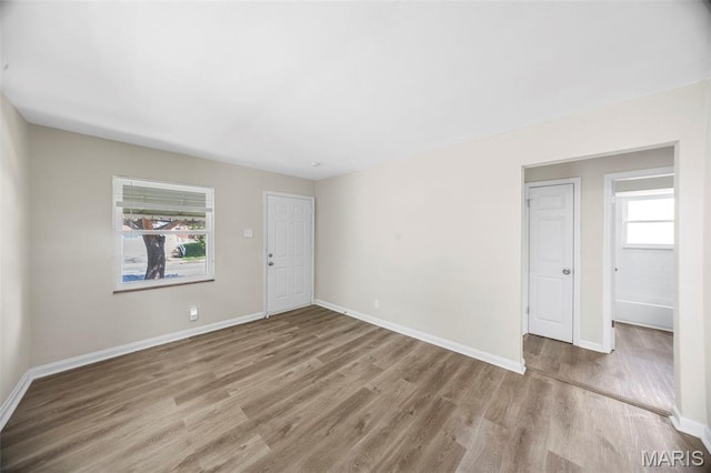 1237 Fairview Ave, University City, MO 63130 - empty room featuring wood finished floors and baseboards