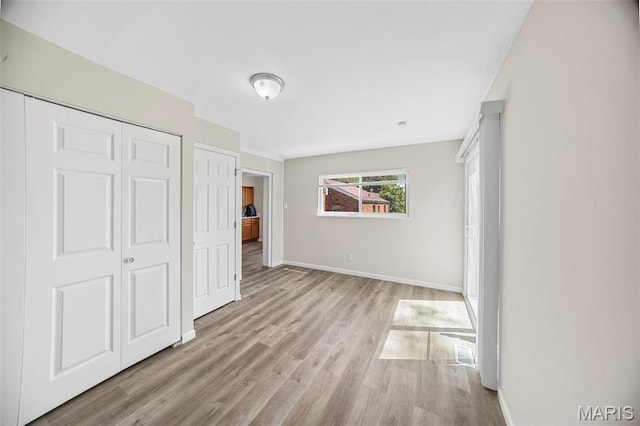 1237 Fairview Ave, University City, MO 63130 - unfurnished bedroom featuring light wood-type flooring and a closet