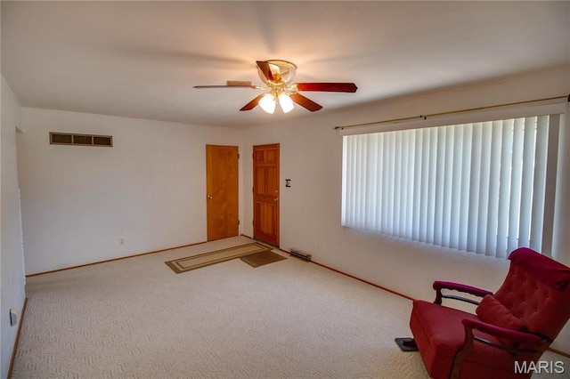 971 Cedar Dr, Wood River, IL 62095 - living area with ceiling fan and carpet flooring