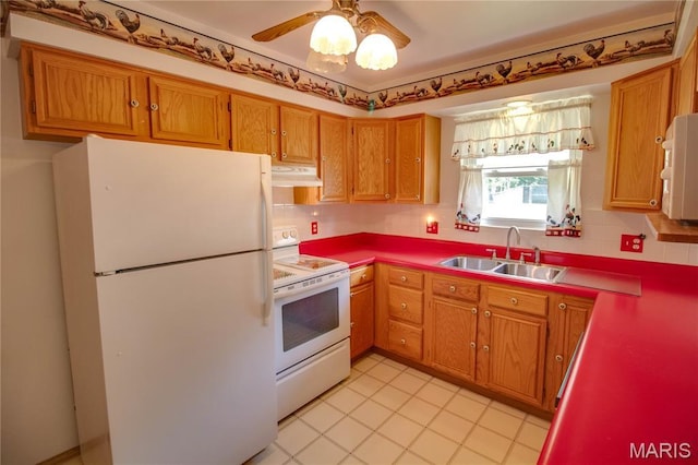 971 Cedar Dr, Wood River, IL 62095 - kitchen featuring white appliances, under cabinet range hood, tasteful backsplash, and light tile patterned flooring