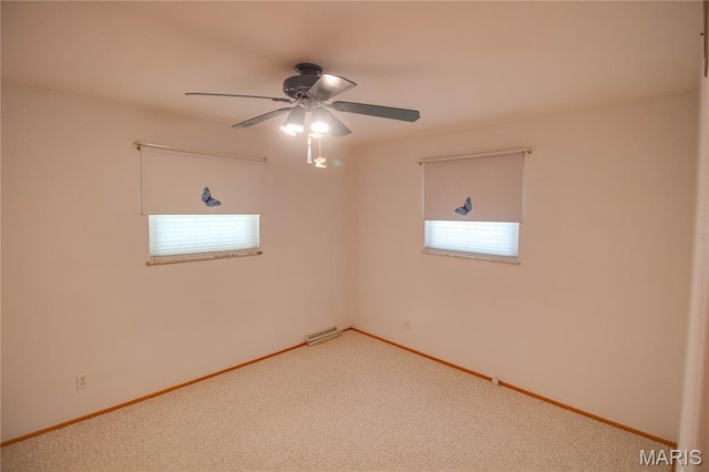 971 Cedar Dr, Wood River, IL 62095 - unfurnished room featuring plenty of natural light, ceiling fan, and carpet floors
