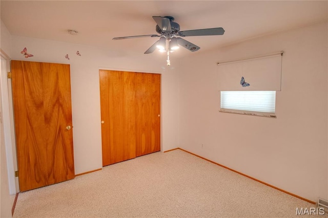 971 Cedar Dr, Wood River, IL 62095 - unfurnished bedroom with a closet, carpet flooring, and ceiling fan