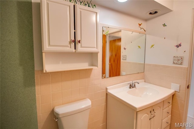 971 Cedar Dr, Wood River, IL 62095 - bathroom with vanity, tile walls, and wainscoting