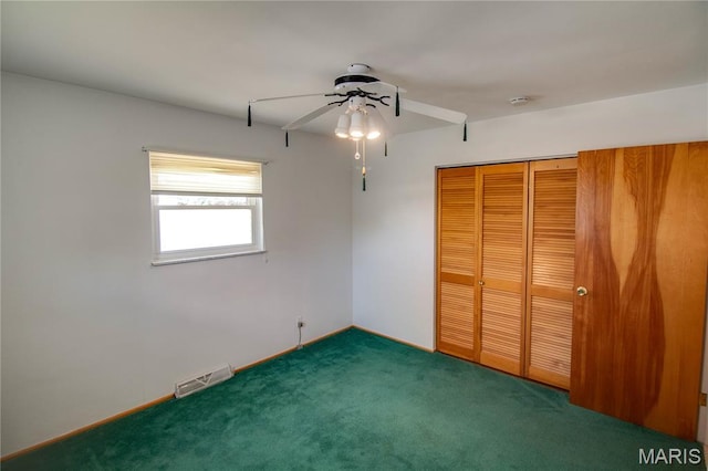 971 Cedar Dr, Wood River, IL 62095 - unfurnished bedroom featuring carpet flooring, a closet, and ceiling fan