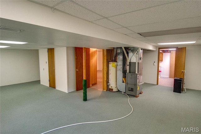 971 Cedar Dr, Wood River, IL 62095 - finished below grade area with gas water heater, heating unit, carpet floors, and a paneled ceiling