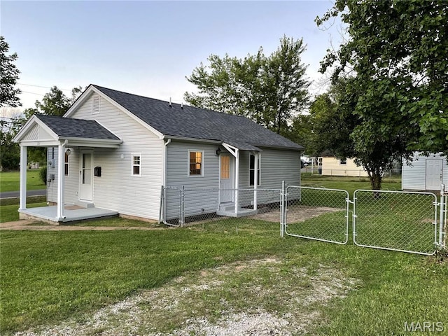 211 N Davis St, Cuba, MO 65453 - view of property exterior featuring a shingled roof and a gate
