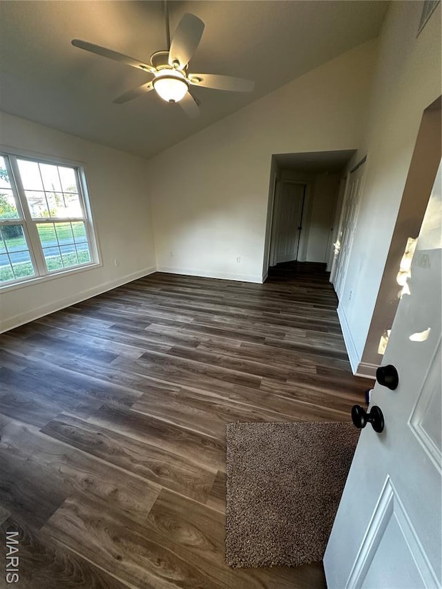 211 N Davis St, Cuba, MO 65453 - spare room featuring vaulted ceiling, a ceiling fan, and dark wood-style flooring