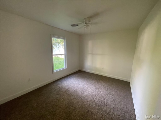 211 N Davis St, Cuba, MO 65453 - spare room with dark carpet and a ceiling fan