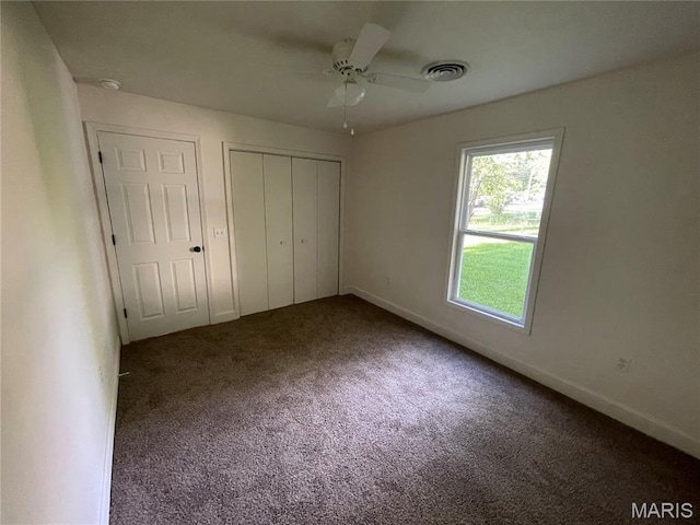 211 N Davis St, Cuba, MO 65453 - unfurnished bedroom featuring carpet flooring, a closet, and a ceiling fan