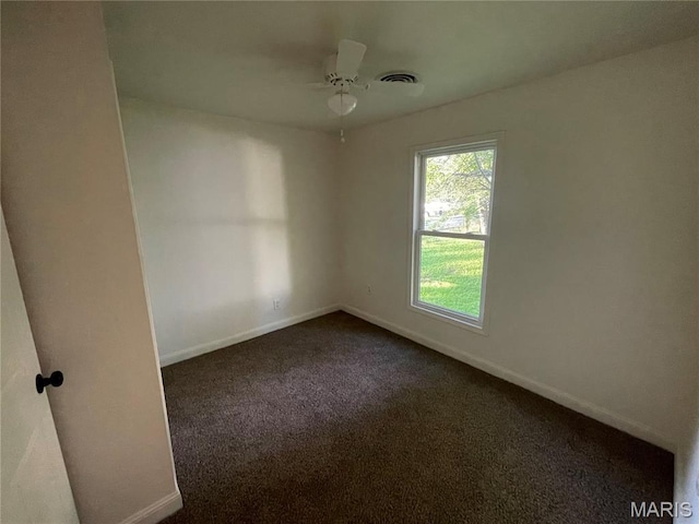 211 N Davis St, Cuba, MO 65453 - empty room with dark carpet and a ceiling fan