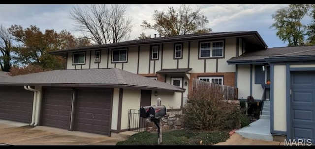 964 Claygate Ct, Ballwin, MO 63021 - view of front of home featuring driveway, brick siding, and a garage