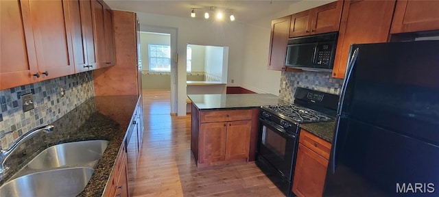 964 Claygate Ct, Ballwin, MO 63021 - kitchen with black appliances, light wood-style flooring, backsplash, and brown cabinetry