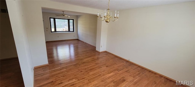 964 Claygate Ct, Ballwin, MO 63021 - spare room with a chandelier and light wood-style flooring