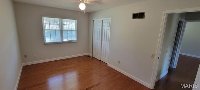 964 Claygate Ct, Ballwin, MO 63021 - unfurnished bedroom with wood finished floors, a closet, and ceiling fan