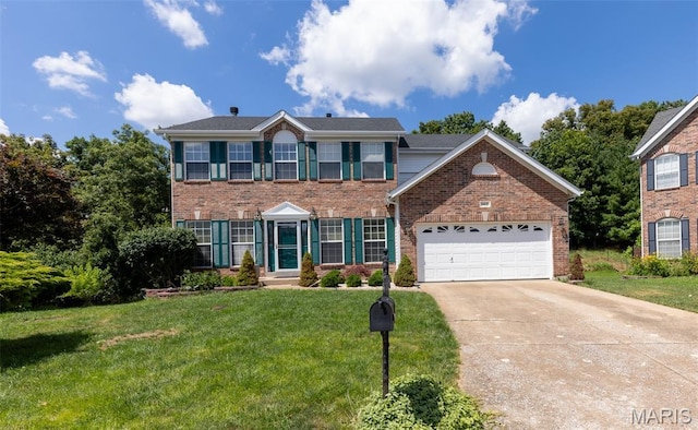 602 Whispering Willows Ct, Ballwin, MO 63021 - colonial house with brick siding, concrete driveway, a garage, and a front lawn