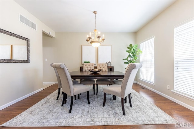 602 Whispering Willows Ct, Ballwin, MO 63021 - dining room featuring a chandelier and wood finished floors