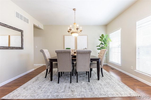 602 Whispering Willows Ct, Ballwin, MO 63021 - dining room featuring a chandelier and wood finished floors