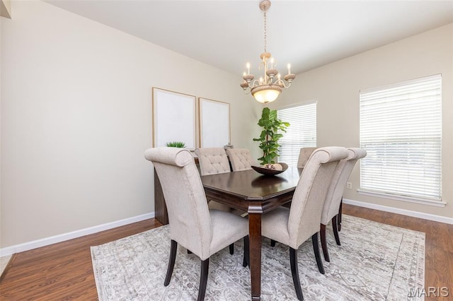 602 Whispering Willows Ct, Ballwin, MO 63021 - dining room featuring a chandelier and wood finished floors