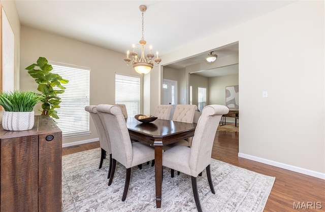 602 Whispering Willows Ct, Ballwin, MO 63021 - dining space with a chandelier and wood finished floors